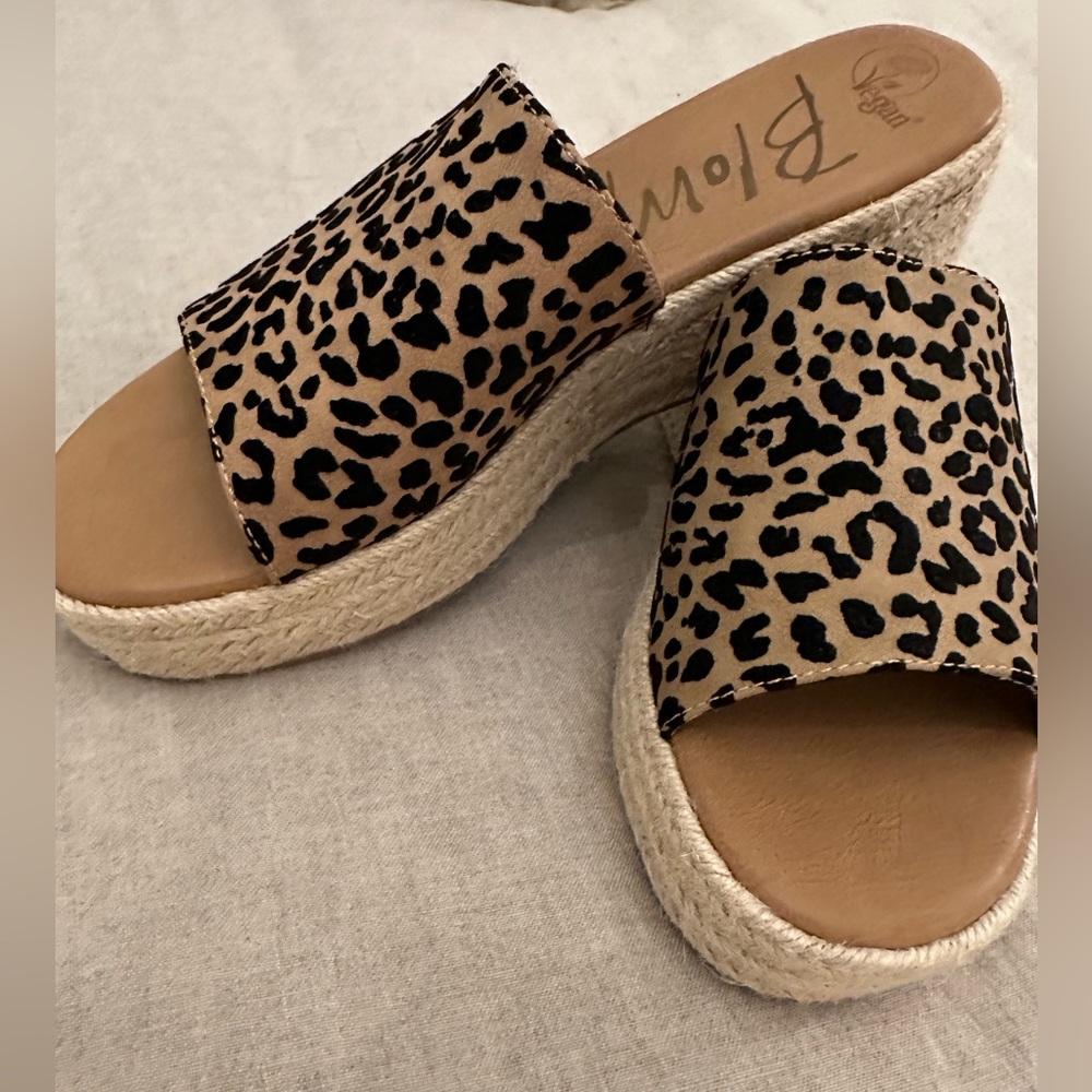 Slip on platform sandals, never worn. Brown with black animal print.